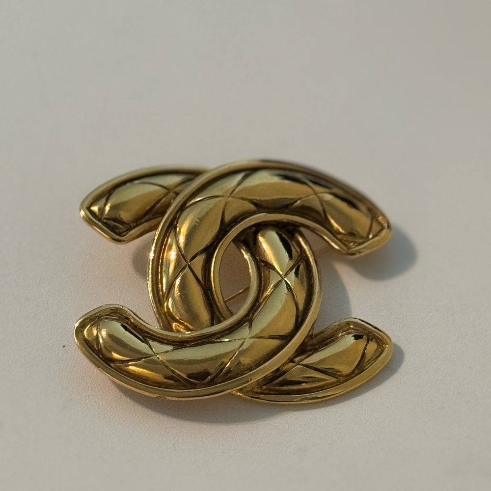 SOLD Gold Interlocking Logo Brooch